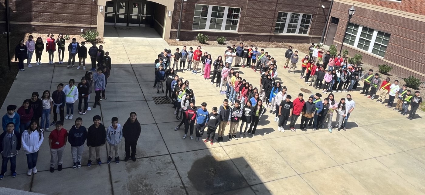 5th grade students arranged in 2024 shape